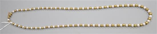 A cultured pearl and yellow metal bead necklace, approx. 70cm.